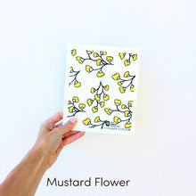 Dish cloth with mustard flower design.