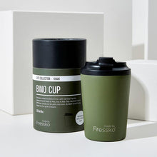 Made by Fressko stainless steel Bino coffee cup in Khaki Green colour with packaging in the background.
