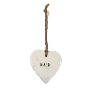 A beautiful glossy hanging heart embossed with the letters "Dad". The heart has a jute string attached to hang your heart up with.