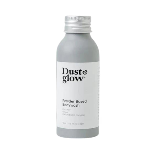 Dust & Glow powder-based bodywash in a grey aluminium bottle.