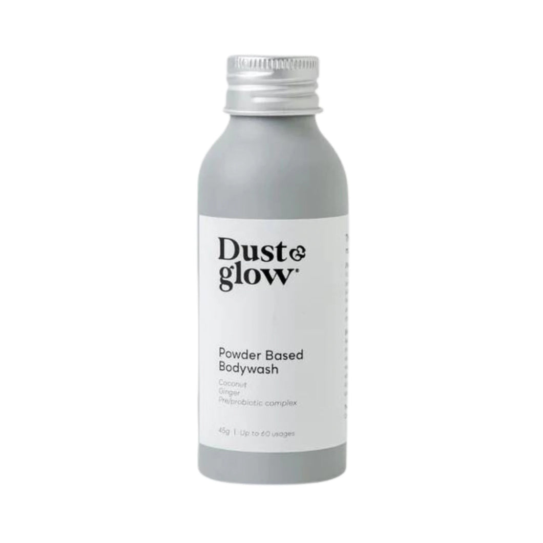 Dust & Glow powder-based bodywash in a grey aluminium bottle.