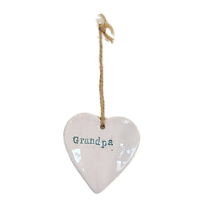 Beautiful white hanging heart embossed with the word "Grandpa" which are light blue, with a jute string to hang your heart up with.