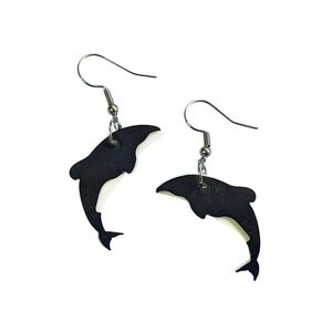 Striking Hector's Dolphins earrings made by Remix Plastic from recycled plastic ice cream container lids.
