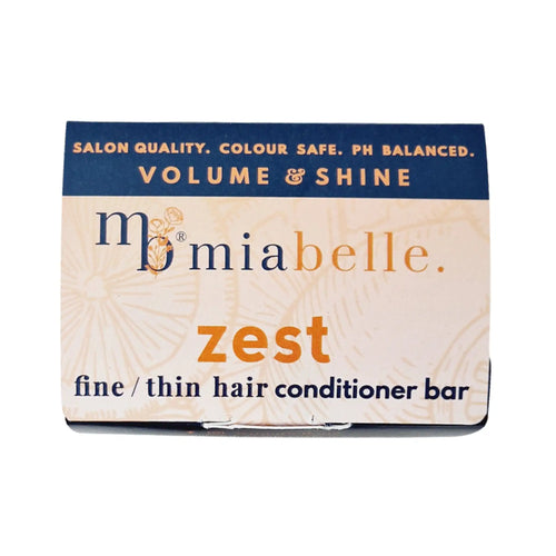 Mia Belle Zest fine / thin hair conditioner bar. Packaging pictured is a nice cool orange with a navy stripe across the top. The packaging reads: Salon quality, colour safe, pH balanced. Volume and shine.