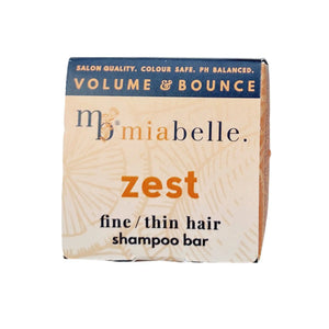 Mia Belle Zest fine / thin hair shampoo bar. Packaging pictured is a nice cool orange with a navy stripe across the top. The packaging reads: Salon quality, colour safe, pH balanced. Volume and bounce.