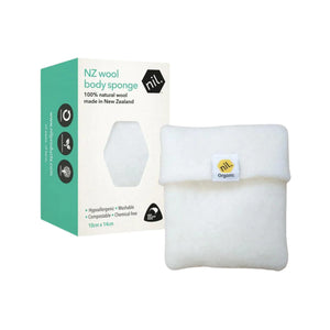 NZ wool body sponge box. 100% natural wool made by nil. in Aotearoa New Zealand. White box with green sides with a window to see the woolen body sponge. Body pocket sponge in white organic wool can be seen to the right of the box.