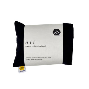Organic cotton wheat pack in black. Made by nil with minimal paper packaging. Heat and apply to aches and pains for instant relaxation.