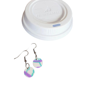 Raw materials: white circular disk earrings and a white single-use plastic coffee cup lid by Remix Plastic.