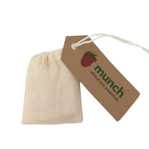 Cream cotton reusable teabag with a drawstring and a tag that reads 
