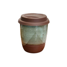 A ceramic travel coffee cup in medium size with a glossy teal partial glaze and a beautiful dark chocolate brown clay underneath with a chocolate brown silicone lid.