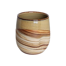 Extra large ceramic drinking tumbler handmade by Wellhandled Ceramics with a marbled clay and a light creamy coffee coloured glaze.