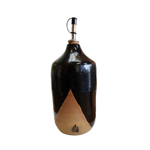 Ceramic oil / vinegar bottle / pourer handmade by Wellhandled Ceramics here in Christchurch, glazed in a cross dipped black glaze and with a pourer spout and cap.