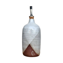 Ceramic oil / vinegar bottle / pourer handmade by Wellhandled Ceramics here in Christchurch, glazed in a cross dipped white glaze and with a pourer spout and cap.