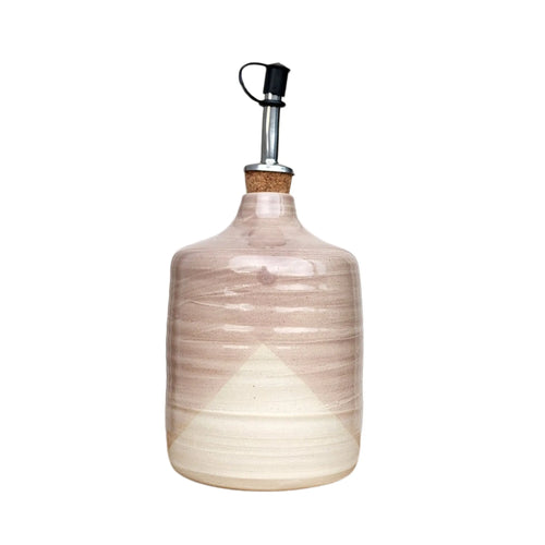 Ceramic oil / vinegar bottle / pourer handmade by Wellhandled Ceramics here in Christchurch, glazed in a cross dipped dusky pink glaze and with a pourer spout and cap.