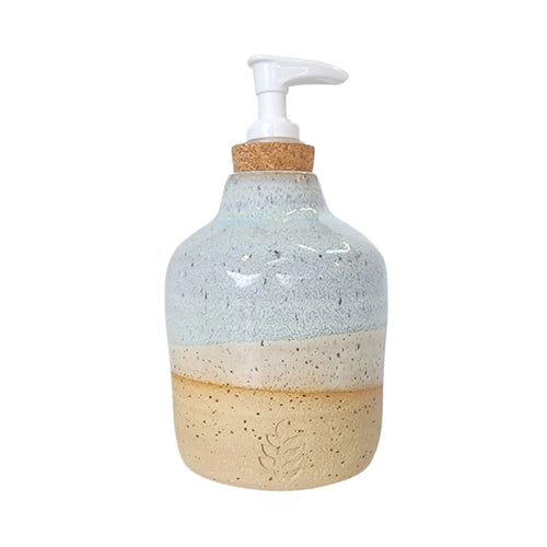 Ceramic hand soap / liquid dispenser bottle hand made by Wellhandled Ceramics. Buff clay with a white and light blue layered glaze inspired by the beach.