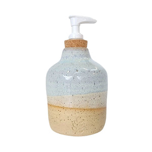 Ceramic hand soap / liquid dispenser bottle hand made by Wellhandled Ceramics. Buff clay with a white and light blue layered glaze inspired by the beach.