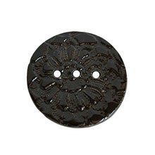 Black round ceramic soap dish handmade by Wellhandled Ceramics with 3 drainage holes and embossed with lace.