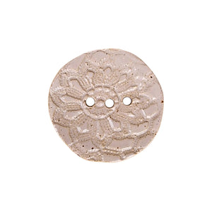 Pink rose circular ceramic soap dish handmade by Wellhandled Ceramics with 3 drainage holes and embossed with lace.