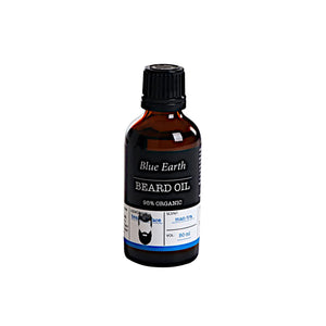 Beard Oil by Blue Earth. Pictured in an amber glass 50ml bottle with a black plastic lid. The label reads: 95% Organic, the scent is man-tra, the usage is beard and face and the beard oil is entirely vegan.