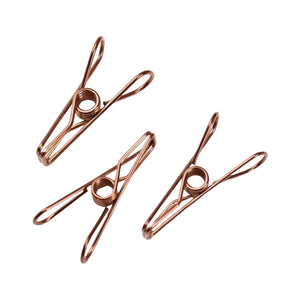 Three high quality Bento Ninja marine grade stainless-steel metal clothes pegs in a rose gold colour.