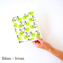 Home compostable dish cloth with bicycles and lime wheels design.