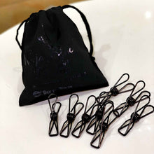 Black stainless steel clothes pegs with reusable black cotton bag.