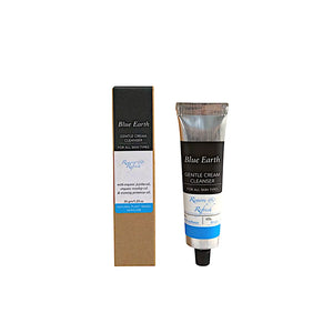 A silver aluminium tube containing Blue Earth Gentle Cream Cleanser with jojoba, rosehip and evening primrose oils. Cardboard box packaging stands to the left of the tube and reads Natural plant-based skincare.