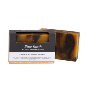 Blue Earth Orange & Cinnamon Swirl Soap bar with sweet oil of orange and the goodness of carrot, pictured with one bar packaged and one bar package free. Label reads: Natural Handmade Vegan soap.