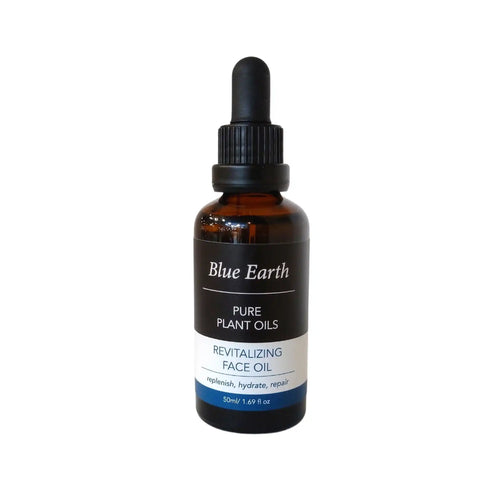 Blue Earth Revitalizing Face Oil in a 50ml amber glass bottle with a dropper top. Pure plant oils.
