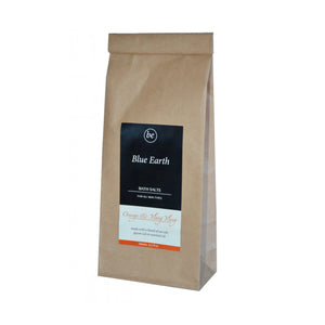 Blue Earth bath salts in a paper refill packet. Packaging reads Orange & Ylang Ylang for all skin types. Made with a blend of sea salt, epsom salt and essential oils.