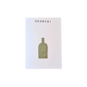 Sustainable greeting card which reads "Cheers" with a single wine bottle underneath which is made from fabric and has been stitched onto the greeting card. Created from second-hand fabric which has been lovingly eco-dyed in Ōtautahi Christchurch by The Clothworks using local flora from our Garden City.