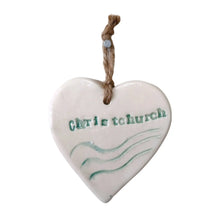 Beautiful white hanging heart embossed with the letters Christchurch along with three wavy lines signifying 3 water bodies. The ceramic heart has a jute string.