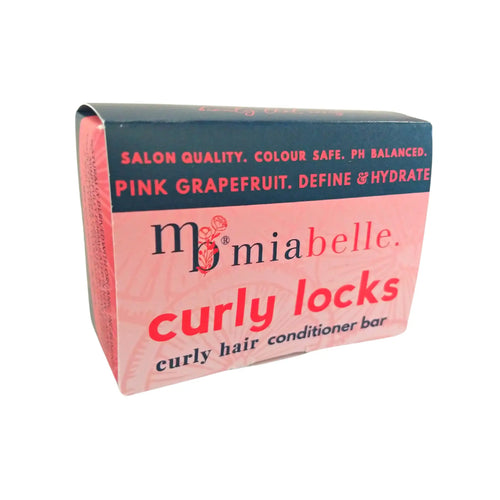 Mia Belle Curly Locks curly hair conditioner bar. Packaging pictured is a nice warm pink with a navy stripe across the top. The packaging reads: Salon quality, colour safe, ph balanced. Pink Grapefruit, define and hydrate.
