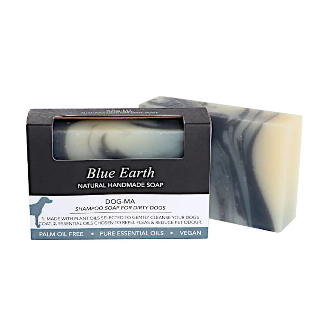 Blue Earth Dog shampoo bar, image is of two shampoo bars, one packaged and one package free. The shampoo bar has black and white swirls of soap and is standing to the right and behind the packaged shampoo bar. The packaging has an open window where you can see and smell the dog shampoo bar and it's black and white swirls. Packaging reads: Natural handmade soap, for dirty dogs, made with plant oils and essential oils chosen to repel fleas and reduce pet odour. Palm oil free, pure essential oils, vegan.