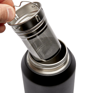 Close up of the two-part stainless steel tea infuser / strainer being lifted out of the stainless steel flask by Fressko.