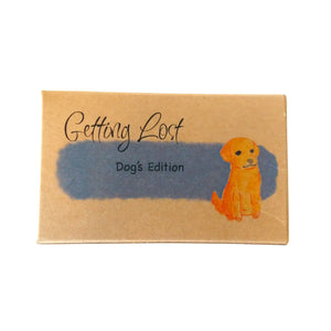 Dog's edition of the Getting Lost Adventure game in a kraft cardboard box with blue cloud and a dog on the front.