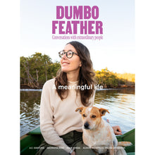 Dumbo Feather Magazine Issue 70. A meaningful life. Conversations with extraordinary people. The front cover of this issue features a lady wearing glasses sitting in a boat on a lake with a dog by her side.