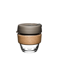 Small reusable glass KeepCup coffee cup with sustainably sourced cork band in the Latte colour scheme which includes a Silver Brown lid and a Smoke coloured plug.