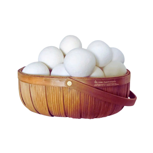 A basket of New Zealand made, 100% natural, eco-friendly white woollen dryer balls. 