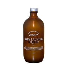500ml amber glass bottle with aluminium screw-top lid containing Baby Laundry liquid. The clear label with white text reads: smaller footprint, greener future, Littlefoot logo, and Baby Laundry Liquid.
