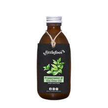 Littlefoot Hand Sanitiser in an amber glass bottle with a white cap. Swing tag reads peppermint and tea tree oil scent with an image of peppermint and tea tree leaves. Stops germs in their tracks. 