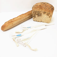 Loot bags with loaf of bread and a baguette.