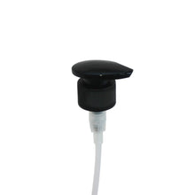 Palm pump top dispenser for use with glass bottles. Black top with white tube for dispensing liquids. 