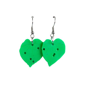Green eco-friendly Kawakawa leaf earrings made by Remix Plastic from recycled 3D printer waste. Hypoallergenic hooks which are silver in colour and the leaves even have looper moth holes.
