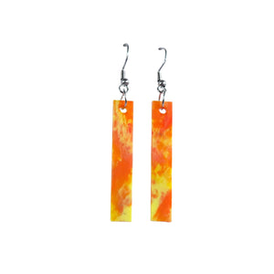 Straight and narrow orange and yellow recycled plastic earrings made from recycled 3D printer waste by Remix Plastic.