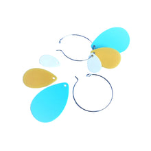 Mix and match light blue teardrop hoop earrings made from recycled plastic ice cream container lids by Remix Plastic. Seen here deconstructed and ready to mix and match.