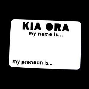 White plastic magnetic reusable name tag with "Kia ora my name is ..." and "my pronoun is ..." laser cut out of the plastic with space to write your name and pronouns with either a whiteboard or permanent marker.