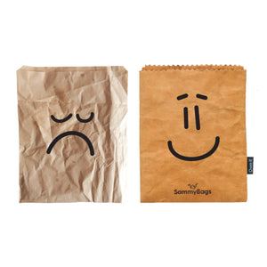SammyBags reusable and washable paper bag with a smiley face pictured alongside a regular disposable paper bag with a sad face.