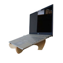 Wooden laptop stand seen here with a silver laptop which has a black screen. Made from plywood in Ōtautahi Christchurch, New Zealand.