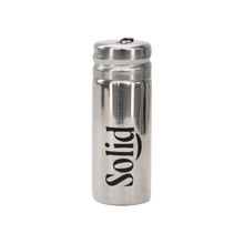 Stainless steel refillable dental floss container by Solid Oral Care. Silver in colour with the Solid logo printed in black on the side.